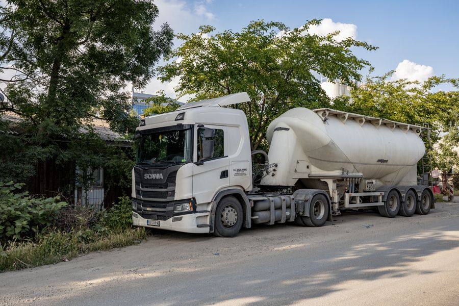 Bulk tanker trailer parked on a rural roadside